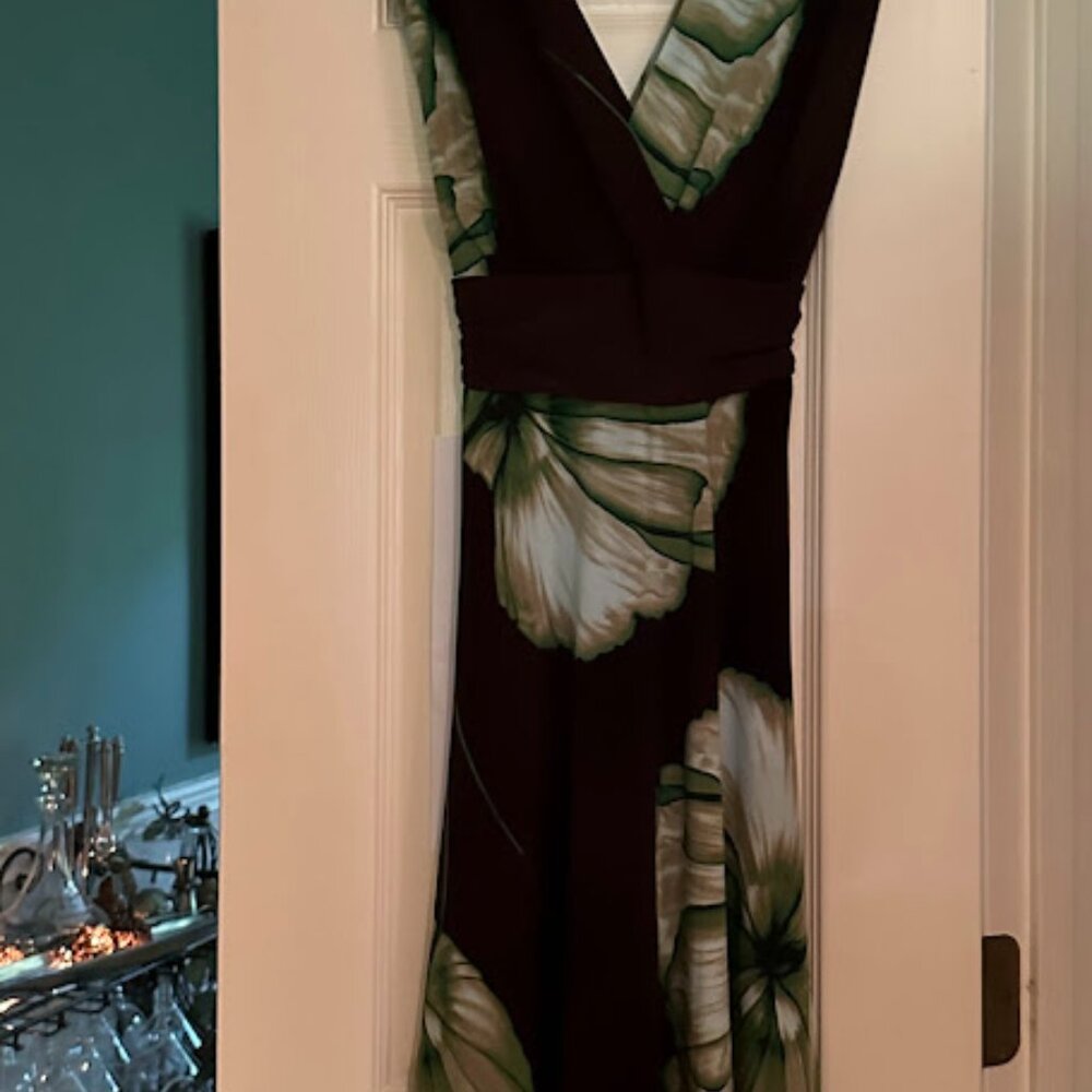 Stylish polyester wrap dress with beautiful colors on brown background.